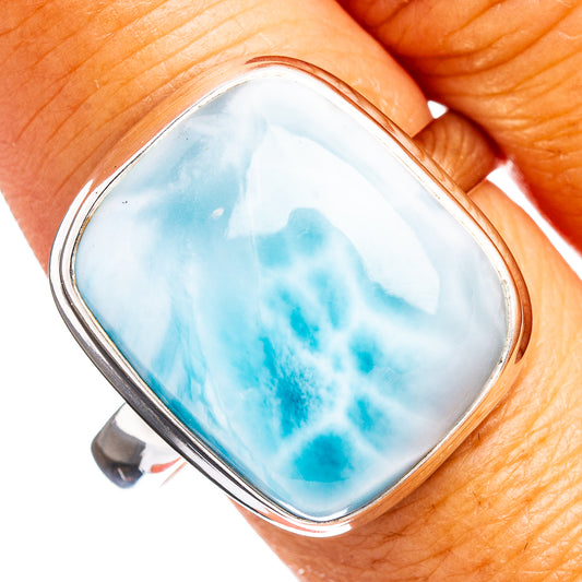 Oval larimar gemstone ring with blue marbled center in .925 sterling silver bezel