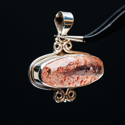 Oval lepidocrocite pendant in .925 sterling silver, ornate loops and open swirl setting