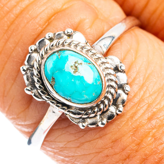 Turquoise oval cabochon sterling silver ring with ornate rope setting