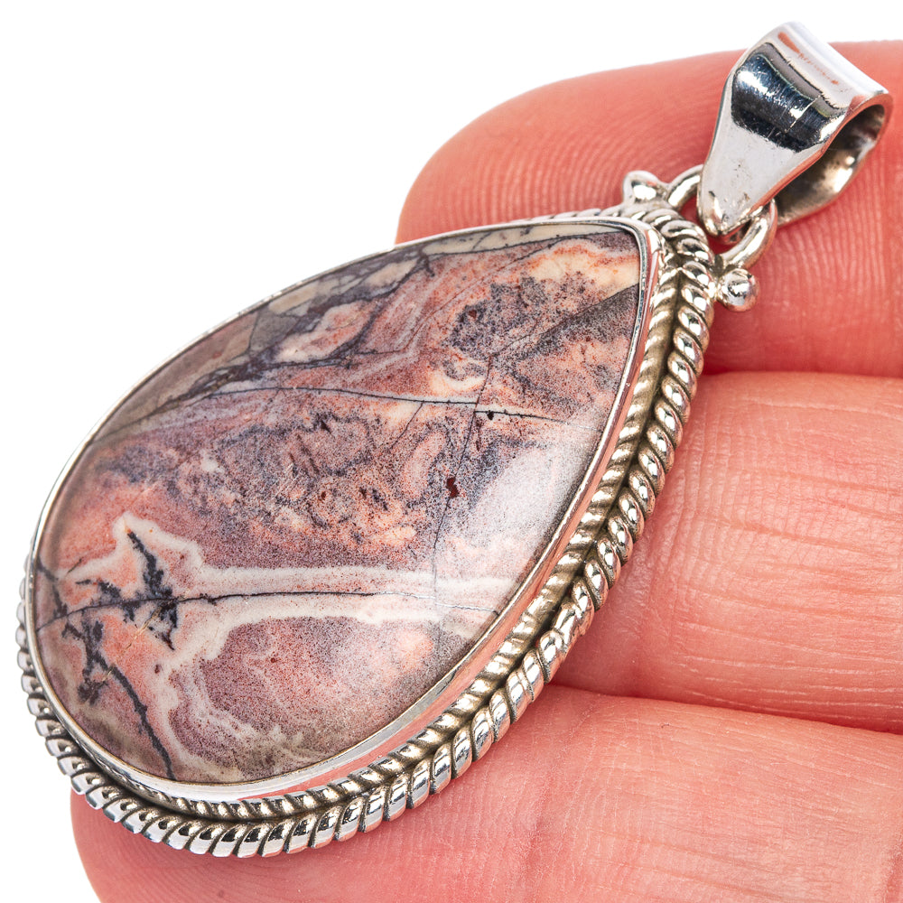Teardrop rosetta jasper pendant with textured silver rope frame; top bail detail.