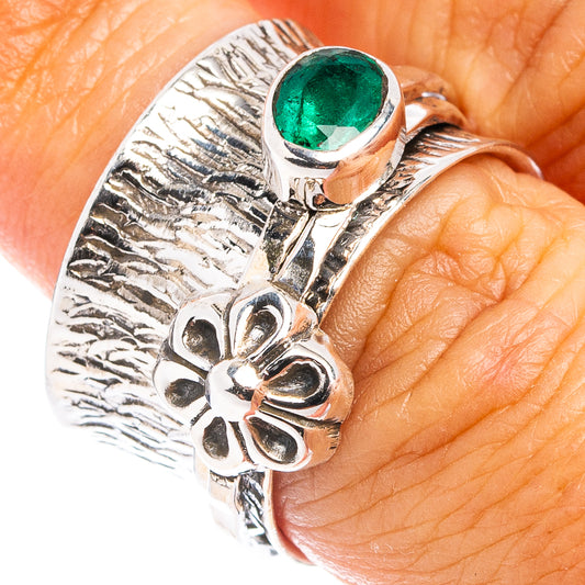 Sterling silver ring with green oval emerald and ornate floral band