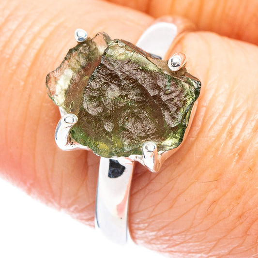 Sterling silver ring with green rough moldavite gemstone and four prong settings