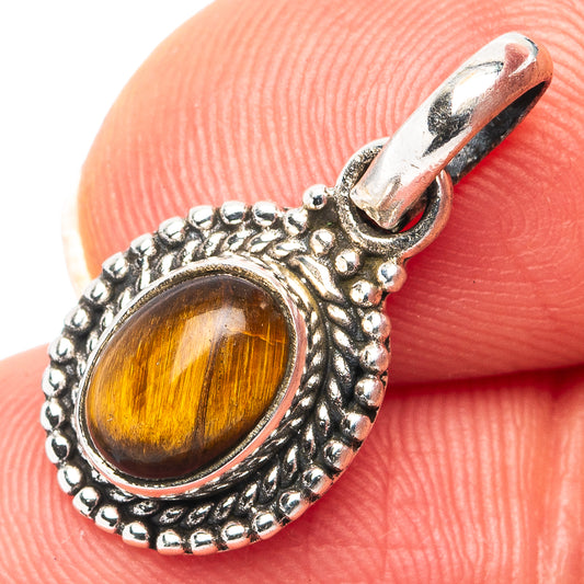 Tiger's eye pendant, oval amber-gold cabochon with .925 sterling silver rope bezel