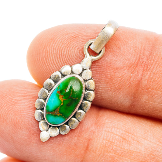 Sterling silver turquoise teardrop pendant with green stone center and bead-edge frame