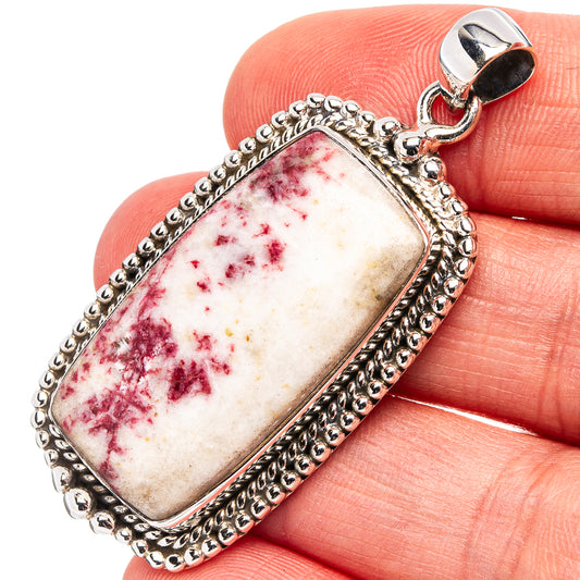 Rectangular .925 sterling silver pendant with red-and-white stone and ornate border