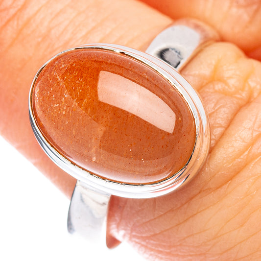 Oval orange sunstone cabochon in .925 sterling silver ring, size 8.25