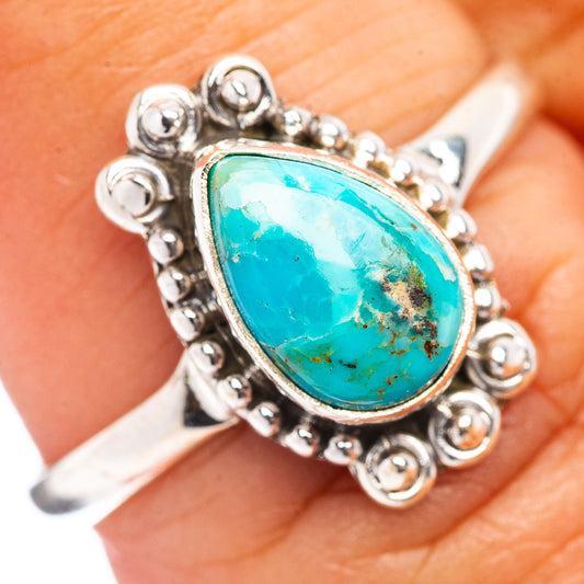 Sterling silver turquoise ring with oval Mojave-style stone, beaded gallery setting