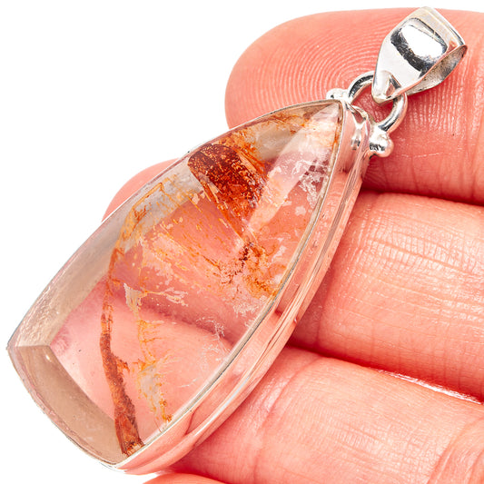 Marcasite-in-quartz pendant, .925 sterling silver bezel and bail; translucent stone with amber flecks