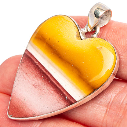 Heart-shaped mookaite stone pendant, amber-and-red with silver bail