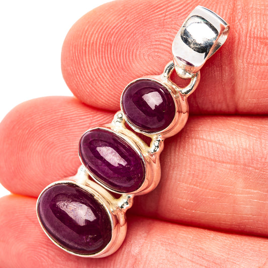 Three-stone ruby pendant with oval maroon stones in sterling silver setting