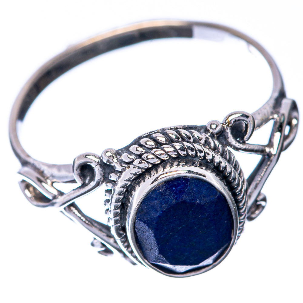 Sterling silver dainty ring with blue sapphire cabochon and braided metal setting