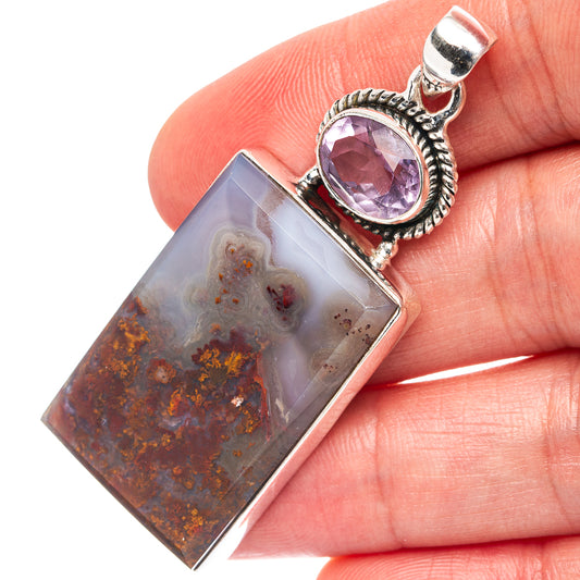 Sterling silver pendant showing rectangular plume agate with amethyst oval top