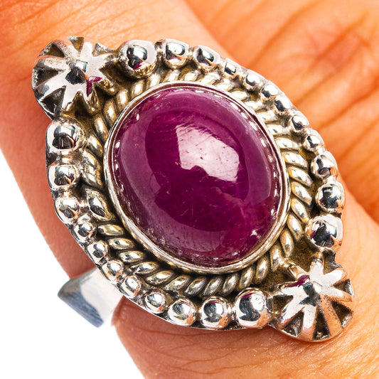 Oval purple star ruby ring with sterling silver basket and starburst bead details