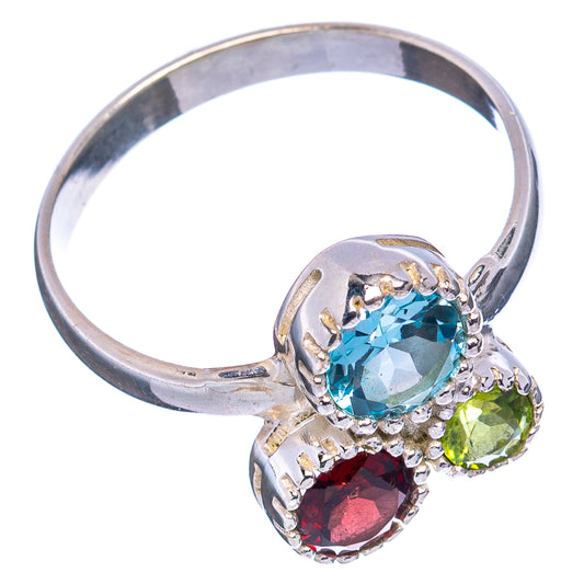 Sterling silver oval gemstone ring with blue topaz center, green peridot and red garnet