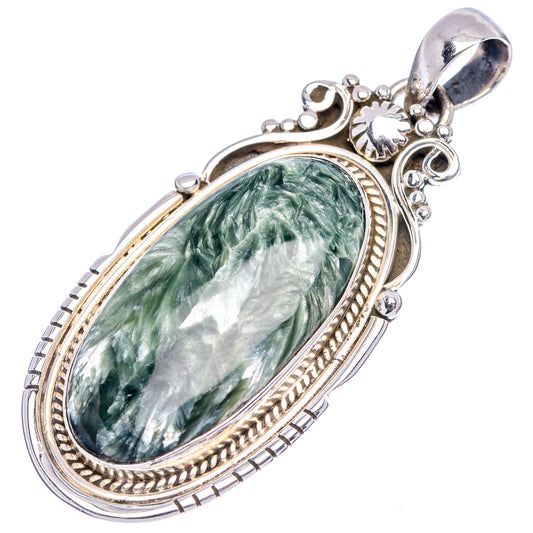 Oval green seraphinite pendant with detailed .925 sterling silver border and side scrolls.