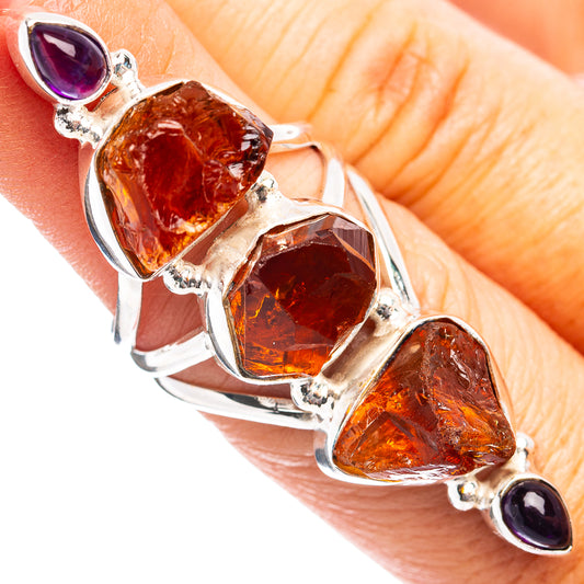 925 sterling silver ring with faceted orange stones and small purple amethyst accents