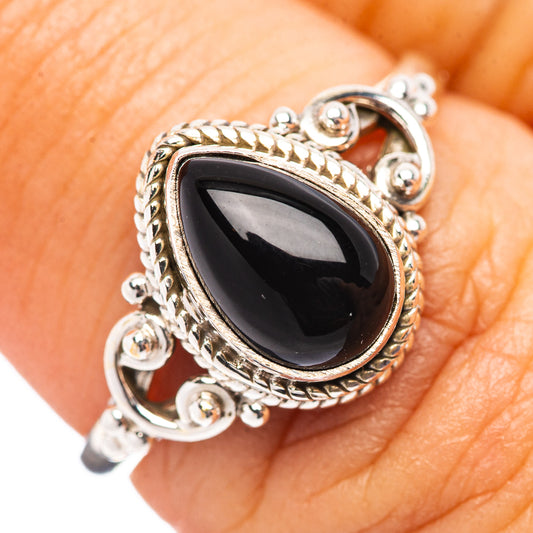 Sterling silver ring with teardrop black onyx cabochon and ornate rope bezel