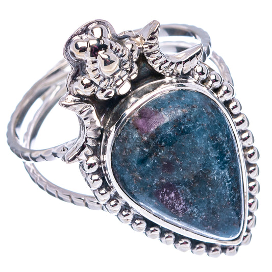 Ornate sterling silver oval cabochon ring with blue/purple stone, beaded side detail
