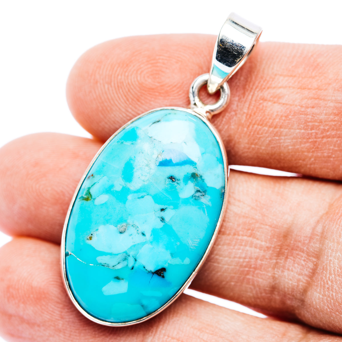 Oval turquoise pendant with sterling silver bezel and loop bail