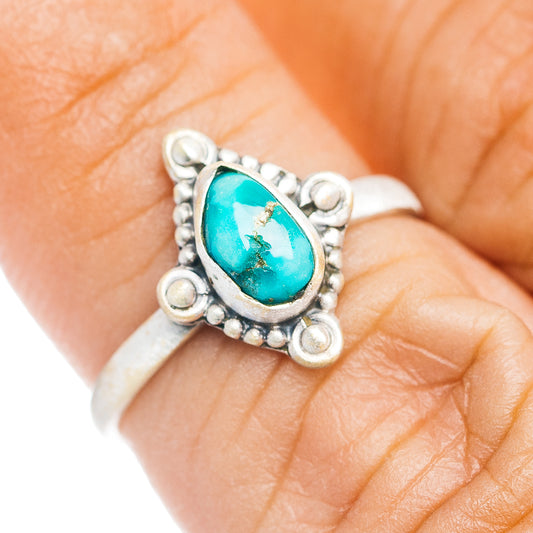 Sterling silver oval turquoise ring with beaded bezel and prong border
