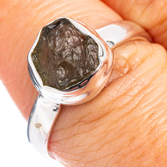 Sterling silver ring with dark green rough teardrop stone, polished bezel setting