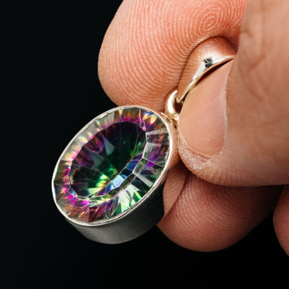 Teardrop sterling silver mystic topaz pendant, close-up side profile with rainbow stone