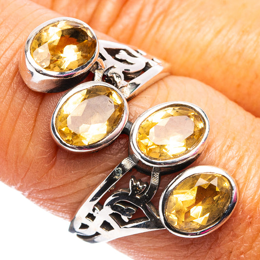 Sterling silver ring with faceted oval citrine stones, ornate openwork band
