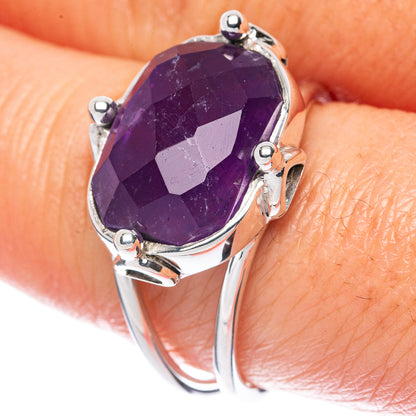 Oval faceted amethyst gemstone sterling silver ring with four-prong setting