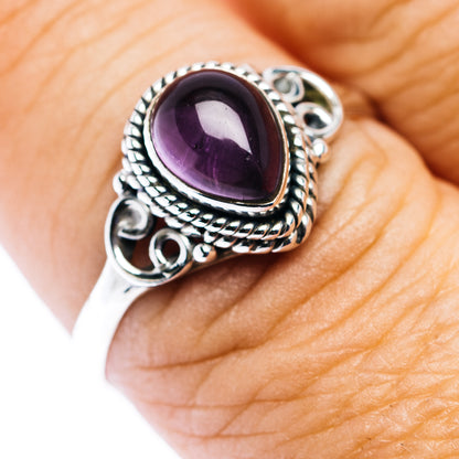 Oval amethyst teardrop ring in .925 sterling silver with ornate rope and scroll band