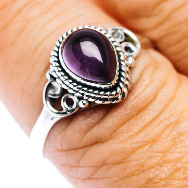 Oval amethyst teardrop ring in .925 sterling silver with ornate rope and scroll band