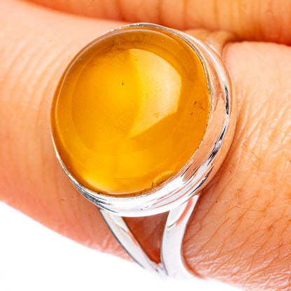 Amber cabochon ring in polished 925 sterling silver with oval yellow stone