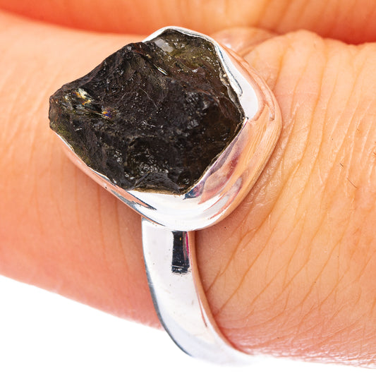 Sterling silver ring with rough dark green Moldavite gemstone in prong setting