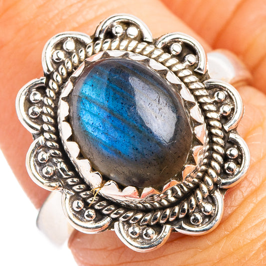 Sterling silver labradorite ring with oval blue gemstone and ornate scalloped bezel