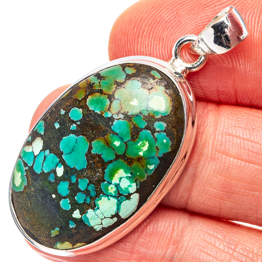 Turquoise oval pendant with sterling silver bail, close-up