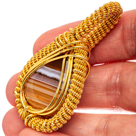 Gold-plated wire-wrap teardrop agate pendant with banded brown and white stripe