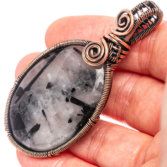 Oxidized copper wire-wrapped pendant with teardrop gray quartz and black tourmaline
