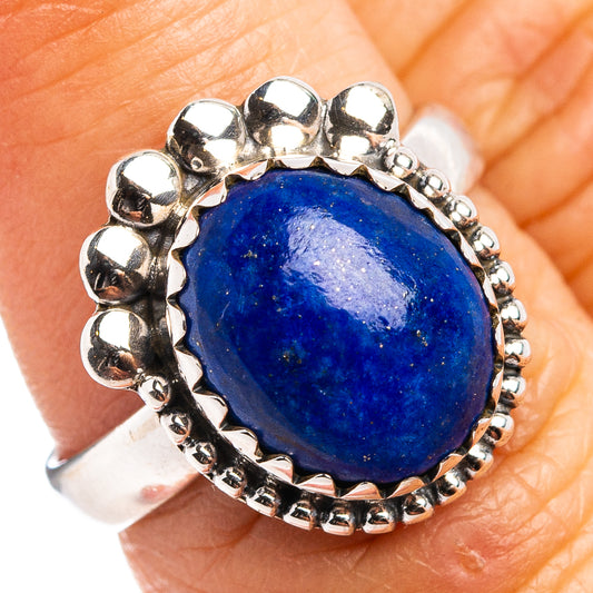 Sterling silver lapis lazuli ring with oval blue cabochon and bead-style setting