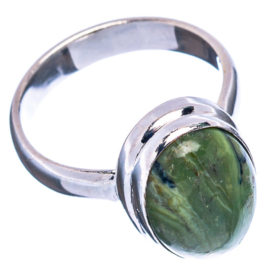 Green opal oval ring on polished silver band, side view with bright reflections