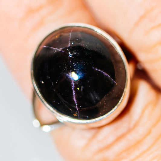 Sterling silver ring with dark star-garnet oval cabochon bezel