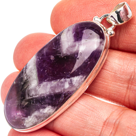 Amethyst pendant with oval purple stone bezel in .925 sterling silver