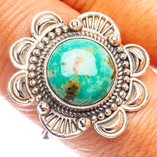 Sterling silver turquoise ring close-up: round blue-green cabochon with bead border