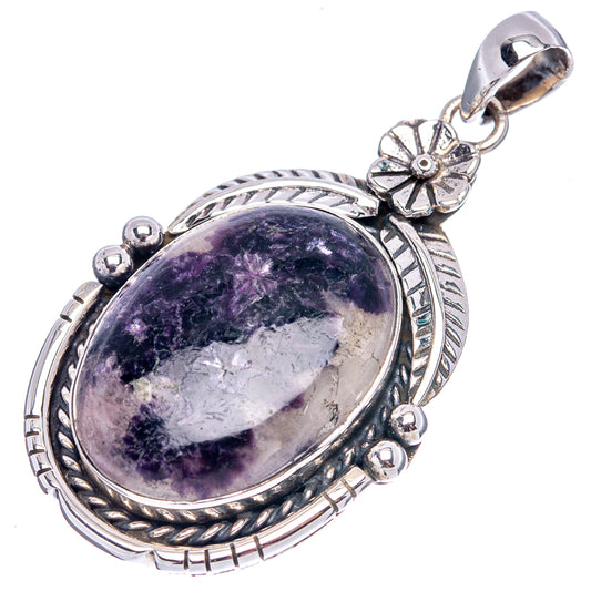 Lepidolite pendant with oval purple stone, floral bail, and decorative .925 sterling silver frame