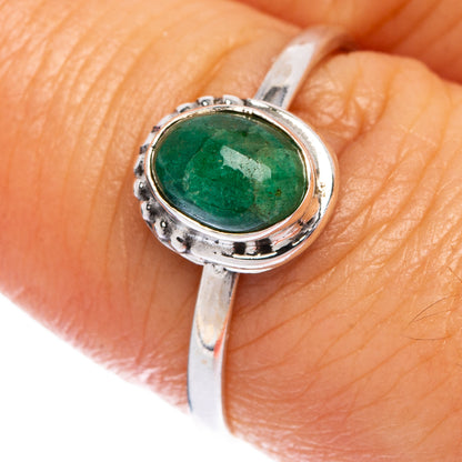 Emerald green oval gemstone sterling silver dainty ring with textured bezel and band
