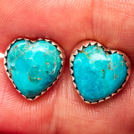 Turquoise heart earrings in sterling silver settings, bezel-edged, gemstone closeup
