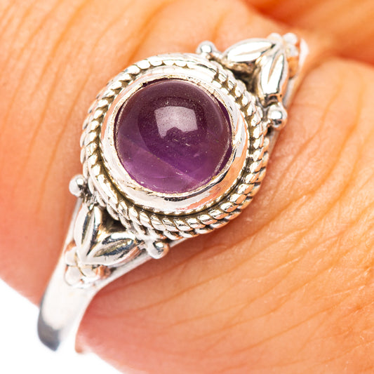 Sterling silver amethyst ring with round purple gemstone and ornate rope bezel