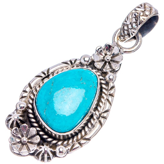 Sterling silver oval turquoise pendant, ornate bezel with floral cutouts and hanging bail