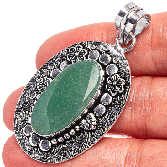 Green aventurine pendant in German silver, oval stone with ornate floral border