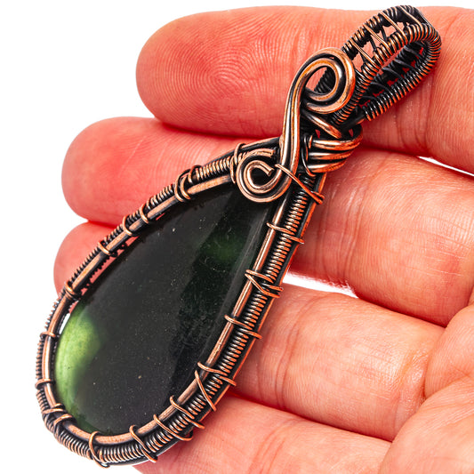 Oxidized copper wire-wrapped teardrop pendant with green nephrite jade cabochon