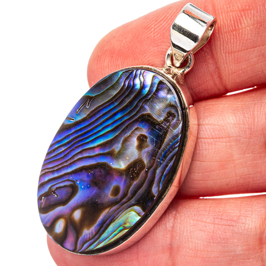 Oval abalone shell pendant in iridescent blue and purple set in sterling silver