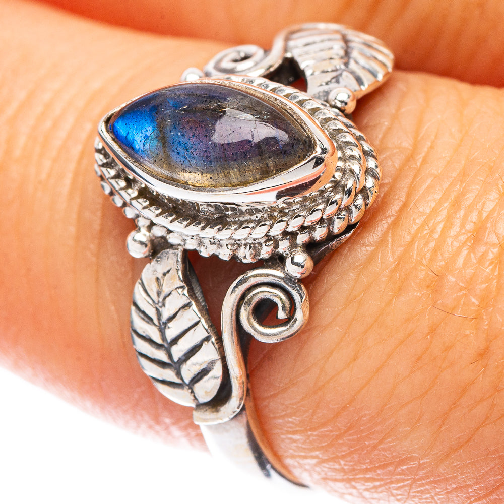 Sterling silver leaf ring with oval labradorite cabochon, blue sheen, on-hand view